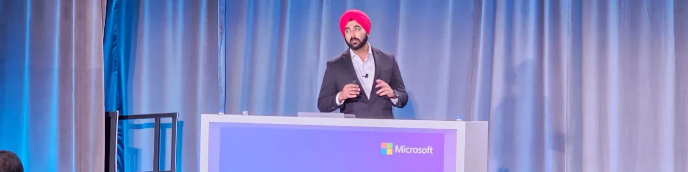 Manpreet Singh speaking on stage